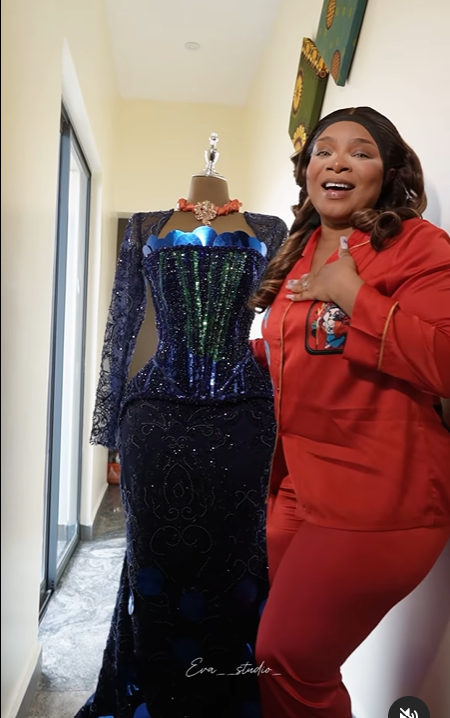An excited queen seeing her dress for the first time [Instagram/ Queen Mercy Atang]
