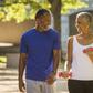 Black couple walking in park