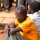 A crowd at the scene where several people died and others went blind after consuming illicit brew in Kirinyaga