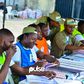 Members of the NYSC as INEC ad-hoc staff at a polling unit in Victoria Island (Pulse)