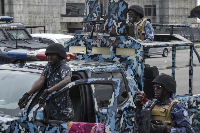 Policemen flood the streets of Port Harcourt, Rivers State. [Getty Images]