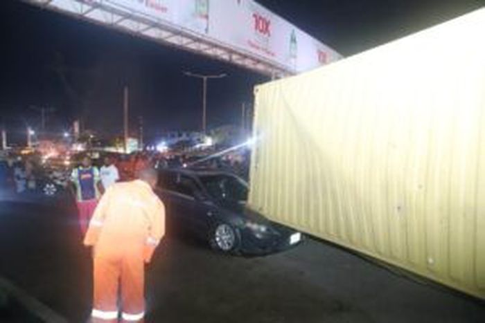 LASEMA rescues driver as container-laden truck falls on car, tricycle in Lagos [NAN]