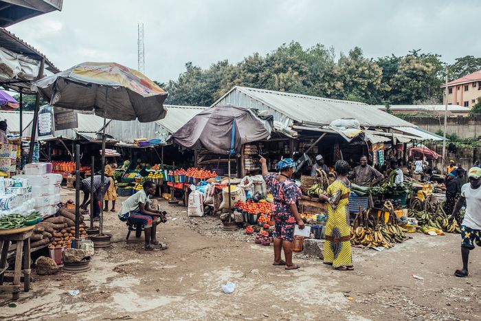Vendors wait for customers on fresh produce stalls at Garki Model Market in Abuja, Nigeria