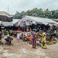 Vendors wait for customers on fresh produce stalls at Garki Model Market in Abuja, Nigeria