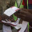 Independent National Electoral Commission (INEC) officials sort and count ballots during the vote counting process at a polling station in Kano on February 25, 2023, during Nigeria's presidential and general election. [Getty Images]