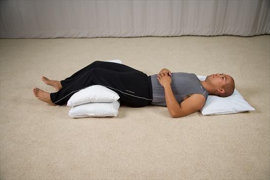 Sleep on your back with a pillow under your knees like so [MyDoctorOnline]