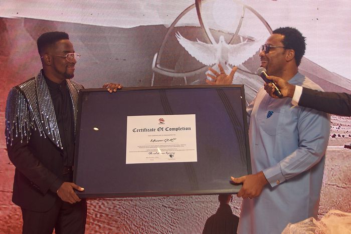 Minister GUC recieves a certificate of completion from Dr Eezee Tee