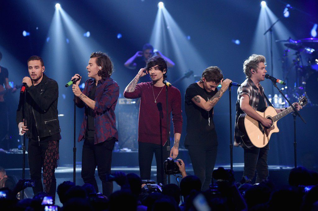 Zayn Malik, center, performs with One Direction in 2014.Ethan Miller/Getty Images for iHeartMedia