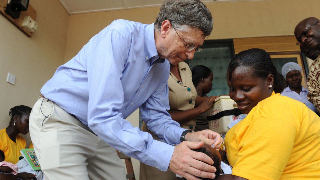 Microsoft's Bill Gates, one of the world's richest men and highest profile aid donors vaccinates a child. [Getty Images]