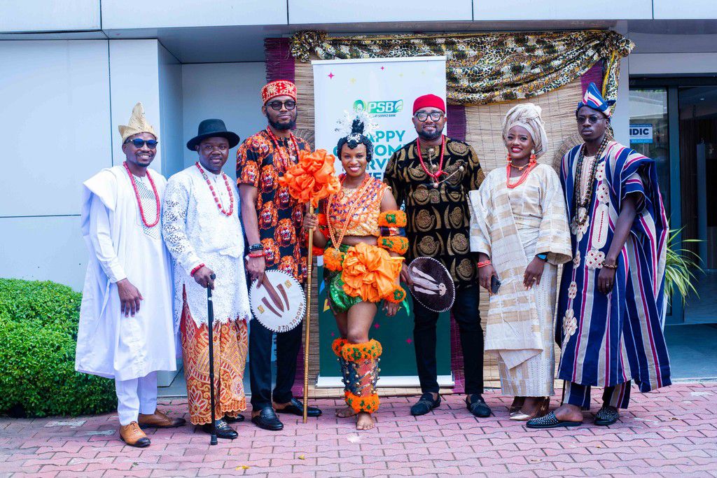 9 Payment Service Bank staff posed in traditional attire during the 2024 Customer Service Week activity held at the bank’s head of in Victoria Island, Lagos.