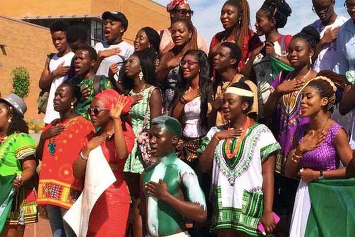 Nigerian youths singing the national anthem. [Zikoko]