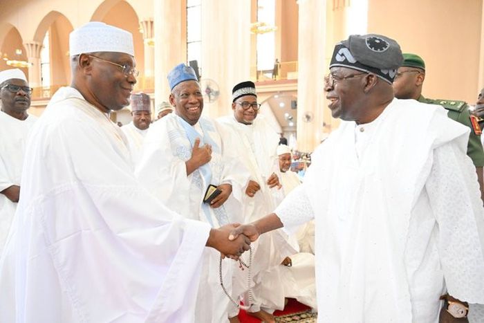 Tinubu, Atiku suspends rivalry, exchange warm handshakes in Abuja mosque