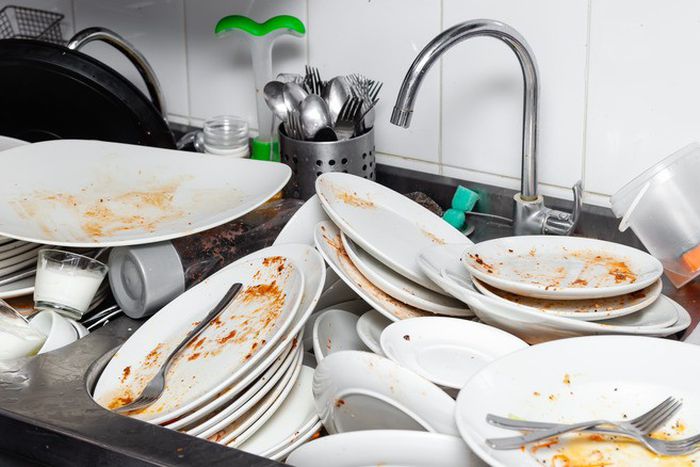 You shouldn’t leave your dishes in the sink overnight [Shutterstock]
