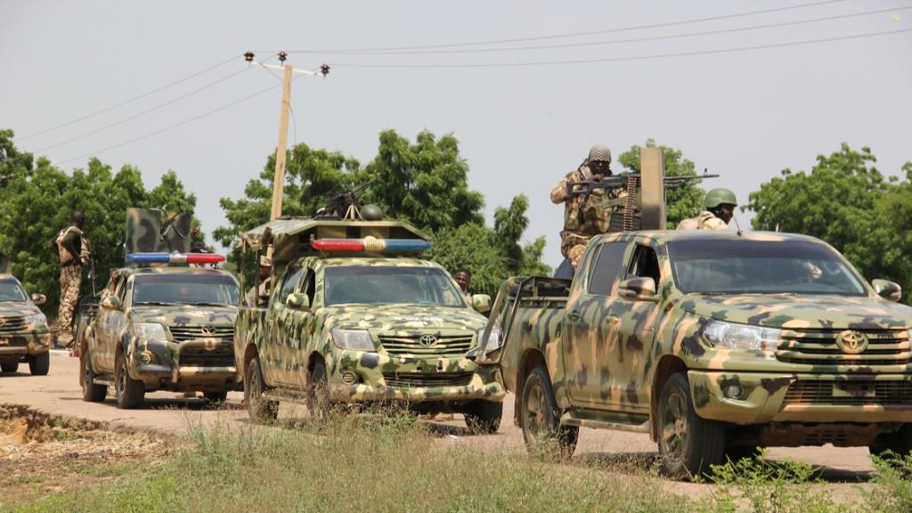 Nigerian soldiers patrol after a suspected gunmen attack. [Getty Images]
