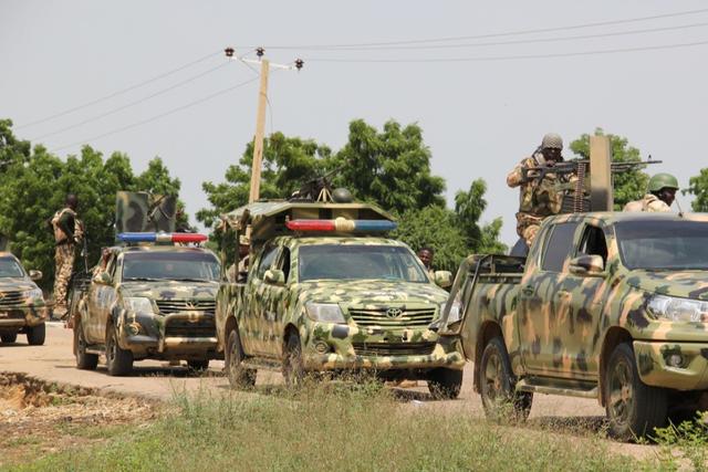 Nigerian soldiers patrol after a suspected gunmen attack. [Getty Images]