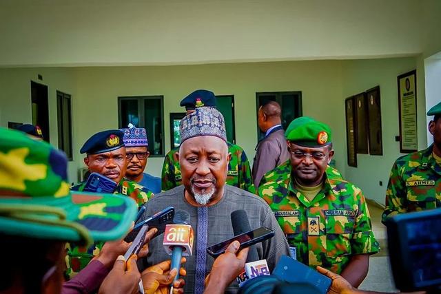 Minister of Defence, Alhaji Mohammed Badaru, inspecting guard of honour during operational visit.