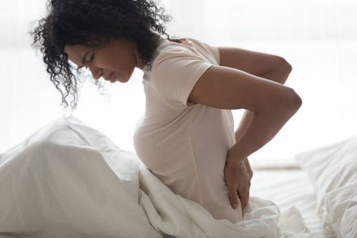 What are the best sleeping positions for reducing back pain? [iStock]
