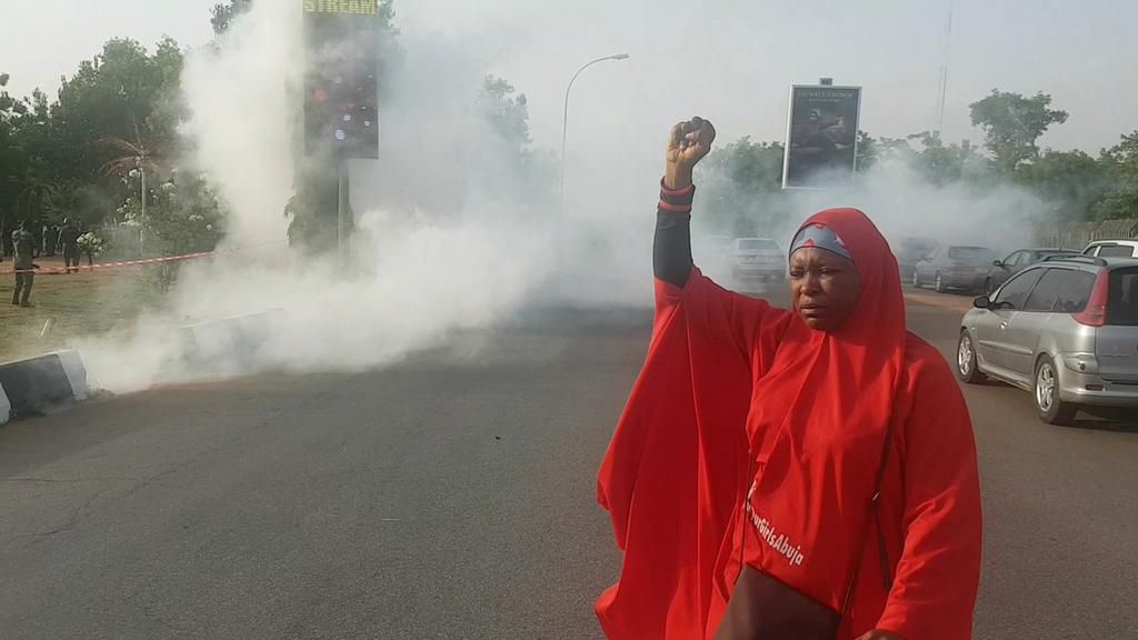 BBOG Co-Convener Aisha Yesufu defies tear gas fumes after police deployed men and canisters to the Unity Fountain