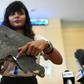 Grace Subathirai Nathan, whose mother Anne Daisy was on board Flight MH370, shows a piece of debris believed to be part of the ill-fated plane