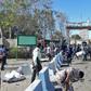 Iranian police survey the aftermath of a suicide car bombing which killed at least two people and wounded many more outside police headquarters in the southeastern port city of Chabahar