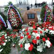 A memorial stone with a plaque which reads in Russian and Polish "To the memory of 96 Poles headed by Polish Republic President Lech Kaczynski, who died in the air disaster near Smolensk on April 10, 2010" at the site of the crash is seen April 2011