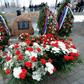 A memorial stone with a plaque which reads in Russian and Polish "To the memory of 96 Poles headed by Polish Republic President Lech Kaczynski, who died in the air disaster near Smolensk on April 10, 2010" at the site of the crash is seen April 2011