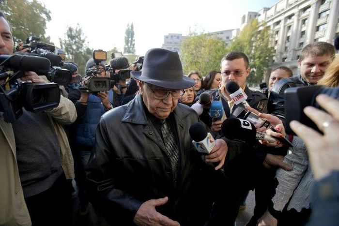 In this file picture, Ioan Ficior is seen leaving the building of the General Romanian Prosecution in Bucharest on October 24, 2013 after being charged with "genocide"
