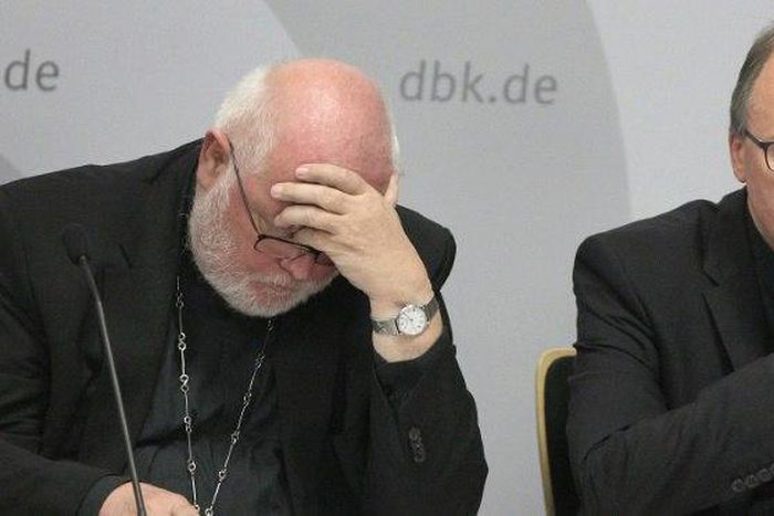 Cardinal Reinhard Marx (L) said he was ashamed over the decades of abuse carried out by Catholic Church officials in Germany