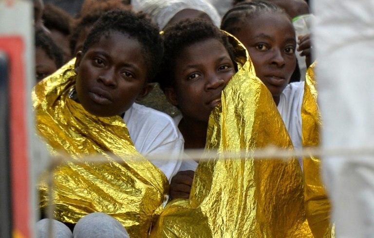 Migrants and refugees are seen on board of the Topaz Responder, a rescue ship run by Maltese NGO MOAS in 2016