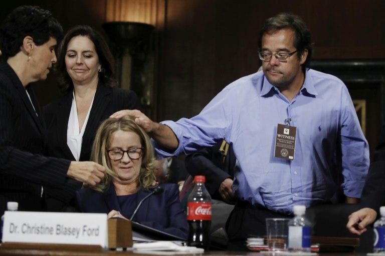 Family friend Keith Koegler pats Christine Blasey Ford on the head at the conclusion of her testimony before the Senate Judiciary Committee -- she also got some help of the caffeinated variety