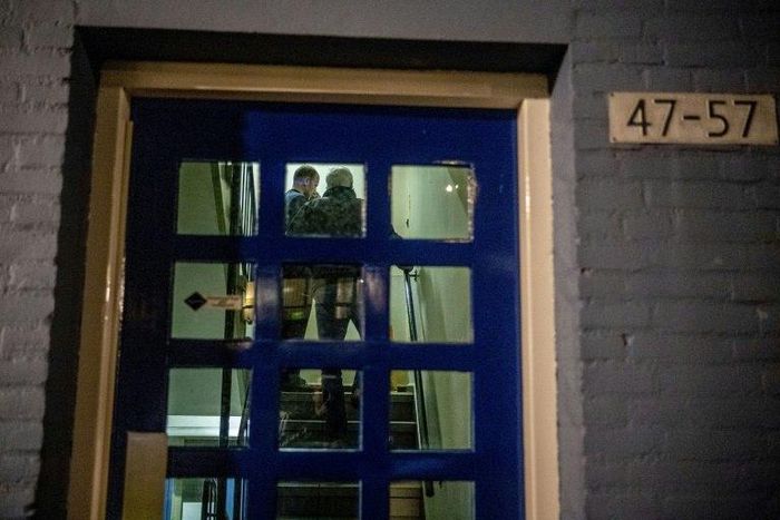 Police officers conduct an investigation at the residence of an alleged jihadist in Rotterdam on September 27, 2018