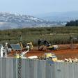 Israeli soldiers deploy excavators alongside the border wall with Lebanon on December 5, 2018, after the army announced it had discovered Hezbollah infiltration tunnels passing under it