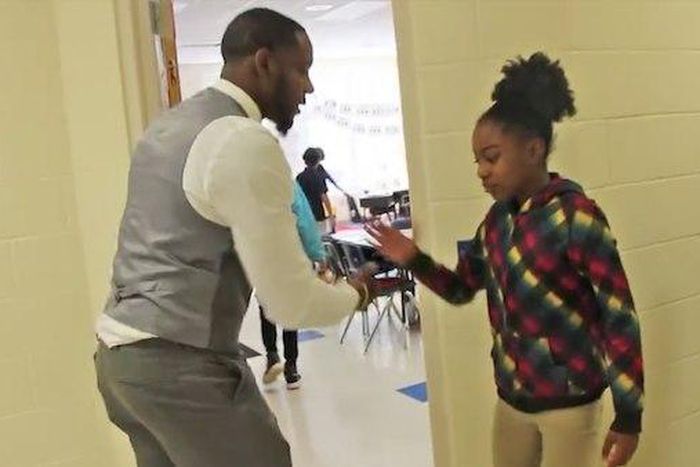 Barry White greeting a student
