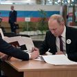 Putin (R) had endorsed the ruling party's candidate in the vote