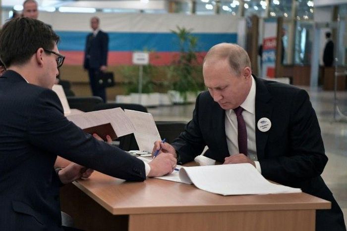 Putin (R) had endorsed the ruling party's candidate in the vote