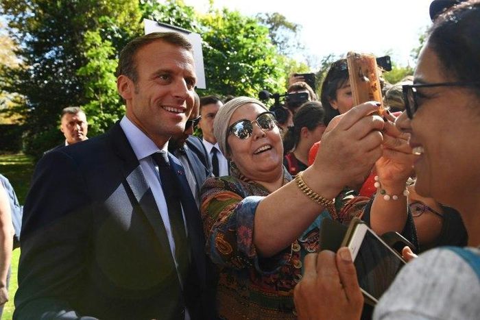Emmanuel Macron with visitors attending the open house at the Elysee Palace on Saturday during France's Heritage Days