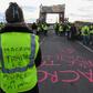 A yellow vest protester blocking a fuel depot in Frontignan, southern France, on Monday. Her vest reads "Macron traitor, the people are hungry."