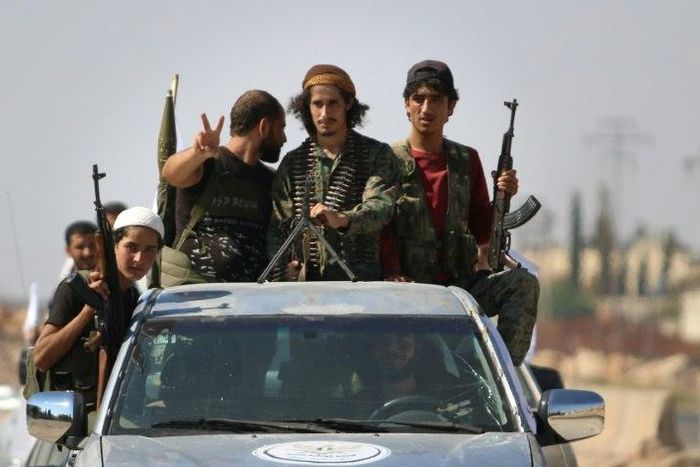 Syrian rebel fighters are seen in the northern countryside of Idlib province on September 11, 2018