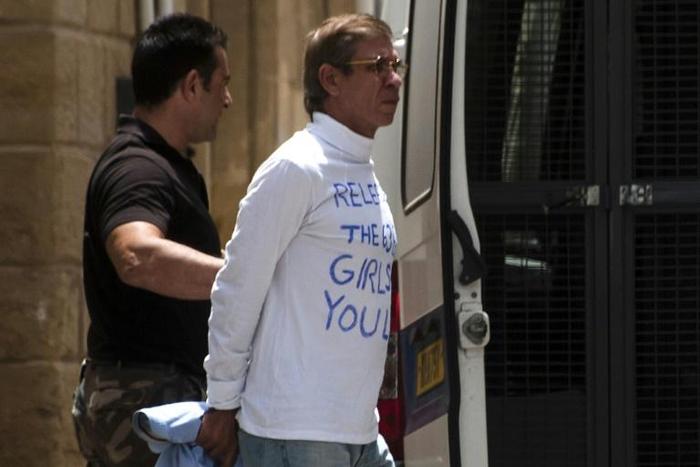 Egyptian Seif al-Din Mohamed Mostafa is escorted to an extradition hearing in the Cypriot capital Nicosia on May 13, 2016