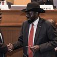President Salva Kiir (R) and his former deputy turned rebel leader Riek Machar (L) signed a peace deal last week
