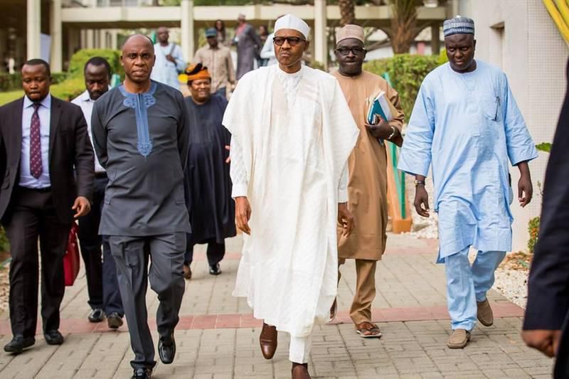 Amaechi and President Buhari with aides