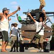 Libyan militiamen loyal to the Government of National Accord (GNA), Libya's internationally recognised government, celebrate advances in the south of the capital Tripoli on September 25, 2018
