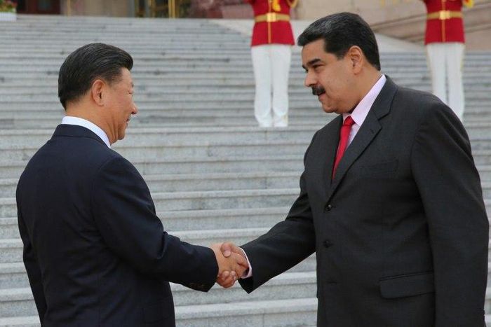 Venezuelan President Nicolas Maduro, shown here with Chinese counterpart Xi Jinping, says China agreed to oil industry financing
