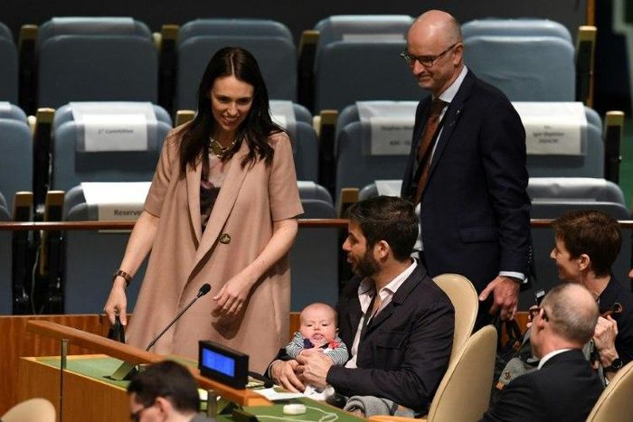 New Zealand Prime Minister Jacinda Ardern, left, has made history by bringing her baby to the United Nations General Assembly, here held by her partner Clarke Gayford