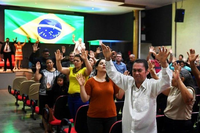 Faithful pray at an evangelical church in Brasilia for the recovery of the health of Brazilian right-wing presidential candidate Jair Bolsonaro, who suffered a knife attack during the campaign