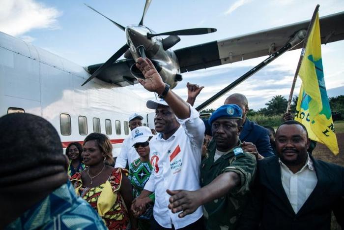 Martin Fayulu (C), who is vying to replace President Joseph Kabila in the pivotal December 23 polls, was greeted by thousands at a small airport near the restive eastern city of Beni in North Kivu