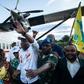 Martin Fayulu (C), who is vying to replace President Joseph Kabila in the pivotal December 23 polls, was greeted by thousands at a small airport near the restive eastern city of Beni in North Kivu