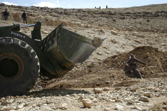 A Palestinian protests against the blocking of the road leading to the village of Khan al-Ahmar in the occupied West Bank on September 14, 2018