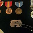 The identity tag and medals belonging to Army Master Sergeant Charles McDaniel, who went missing during the Korean War