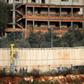 Israeli soldiers stand by machinery near the border wall with Lebanon on December 4, 2018 close to the northern Israeli town of Metula